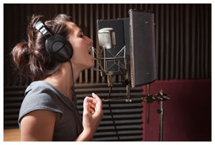 woman-singing-into-microphone-headphones.jpg